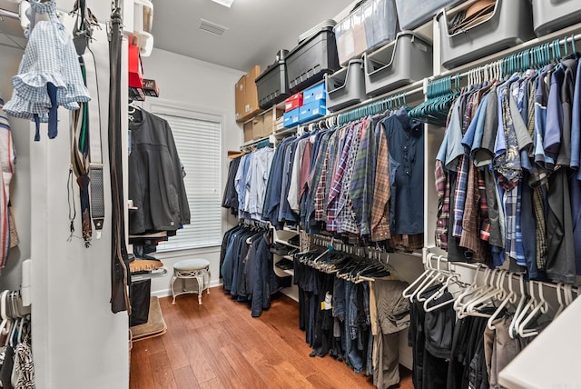 walk in closet featuring wood finished floors and visible vents