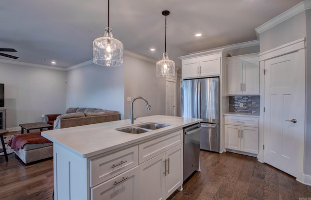 10 Luke Ct, Maumelle, AR 72113 - kitchen with a sink, appliances with stainless steel finishes, open floor plan, and light countertops