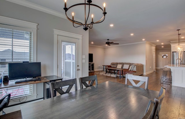 10 Luke Ct, Maumelle, AR 72113 - dining room with crown molding, dark wood-style flooring, ceiling fan with notable chandelier, recessed lighting, and baseboards