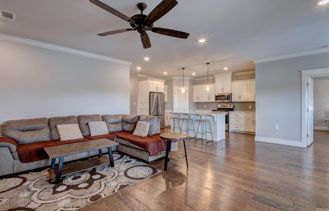 10 Luke Ct, Maumelle, AR 72113 - living room featuring crown molding, recessed lighting, a ceiling fan, wood finished floors, and visible vents