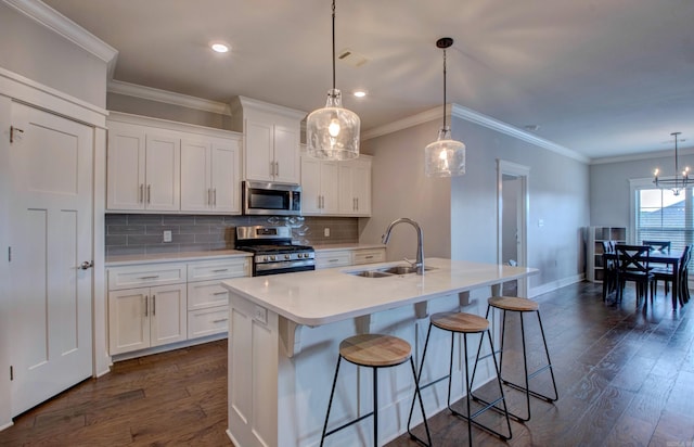 10 Luke Ct, Maumelle, AR 72113 - kitchen featuring a sink, dark wood-style flooring, backsplash, and stainless steel appliances