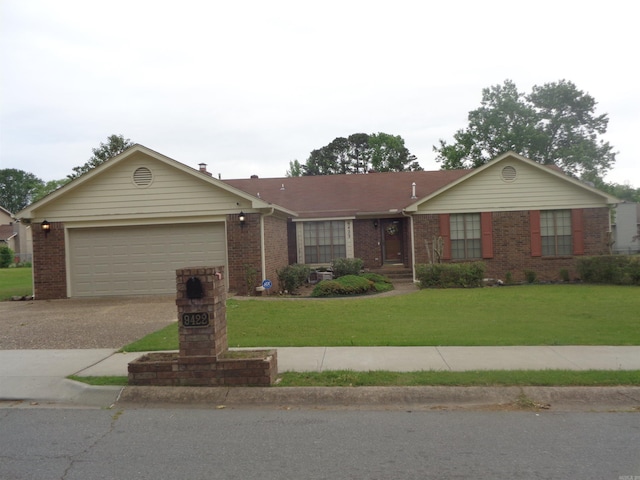ranch-style home with an attached garage, a front yard, driveway, and brick siding