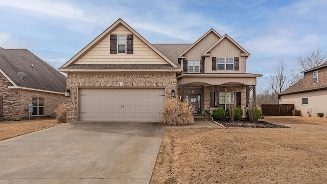 5485 Viney Creek Ln, Jonesboro, AR 72404 - craftsman inspired home with driveway, brick siding, a garage, covered porch, and board and batten siding
