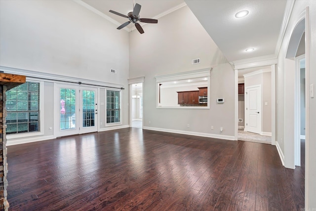5485 Viney Creek Ln, Jonesboro, AR 72404 - unfurnished living room with ceiling fan, wood finished floors, crown molding, baseboards, and a towering ceiling