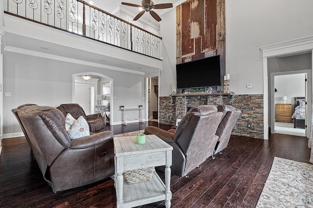 5485 Viney Creek Ln, Jonesboro, AR 72404 - living area with a high ceiling, ceiling fan, crown molding, arched walkways, and dark wood-style flooring