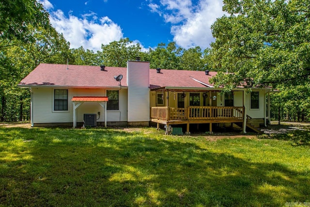 68 Tanner Dr, Bigelow, AR 72016 - back of property with central AC, a yard, a chimney, and a deck