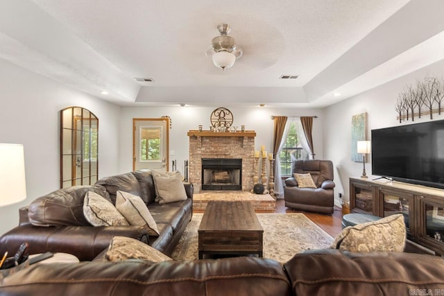68 Tanner Dr, Bigelow, AR 72016 - living room with a raised ceiling, wood finished floors, and visible vents