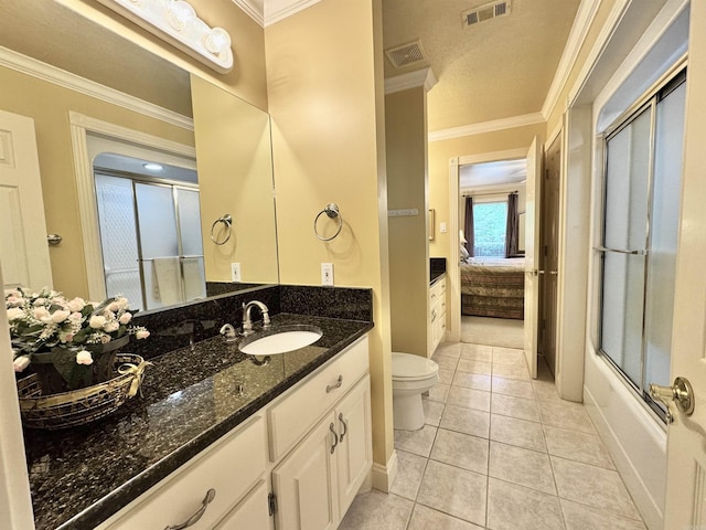 bathroom with vanity, ornamental molding, toilet, and visible vents