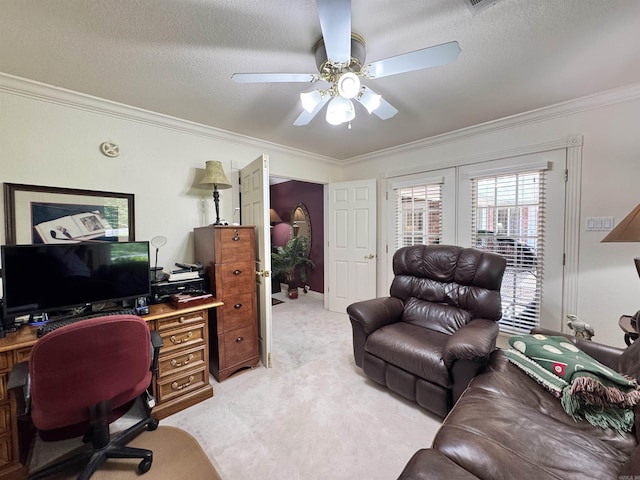 office with crown molding, a textured ceiling, ceiling fan, and light carpet