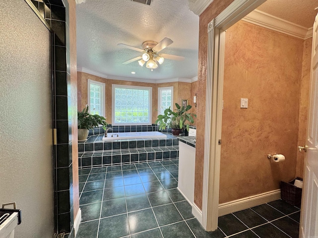 bathroom with crown molding, a garden tub, a textured ceiling, tile patterned floors, and a ceiling fan