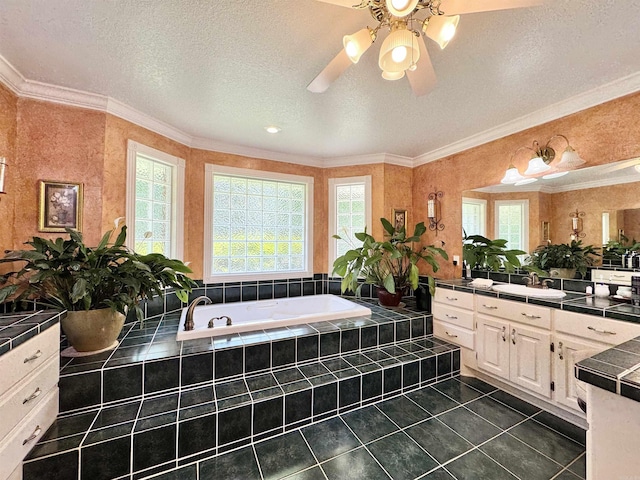 full bathroom with tile patterned flooring, a ceiling fan, a bath, and a healthy amount of sunlight