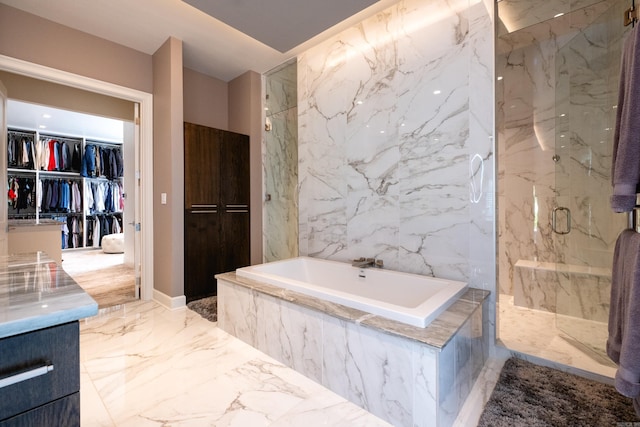 16920 Valley Falls Dr, Little Rock, AR 72223 - full bathroom featuring a marble finish shower, a garden tub, a spacious closet, and marble finish floor