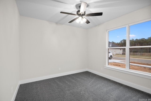 139 Hudson Dr, Sheridan, AR 72150 - empty room with baseboards, dark carpet, and ceiling fan