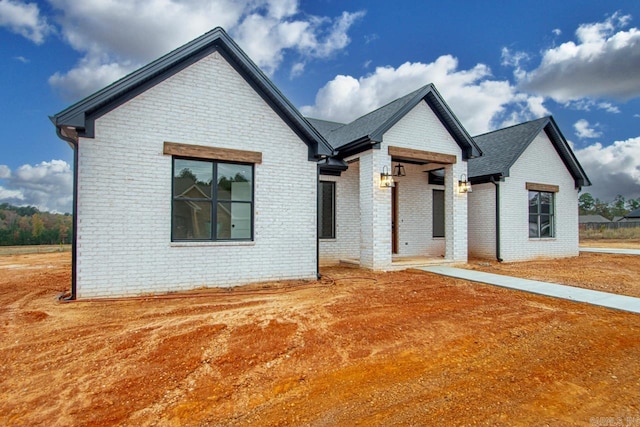 139 Hudson Dr, Sheridan, AR 72150 - modern farmhouse style home with brick siding and a shingled roof