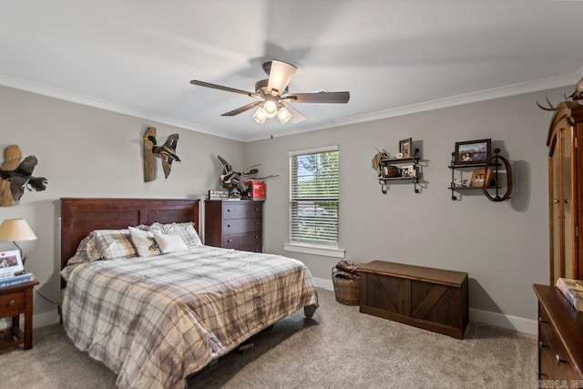 carpeted bedroom with crown molding, a ceiling fan, and baseboards