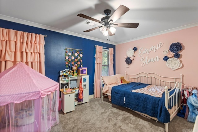 bedroom featuring crown molding, carpet floors, visible vents, and ceiling fan