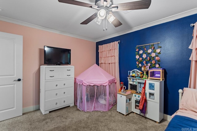 game room with crown molding, ceiling fan, and carpet