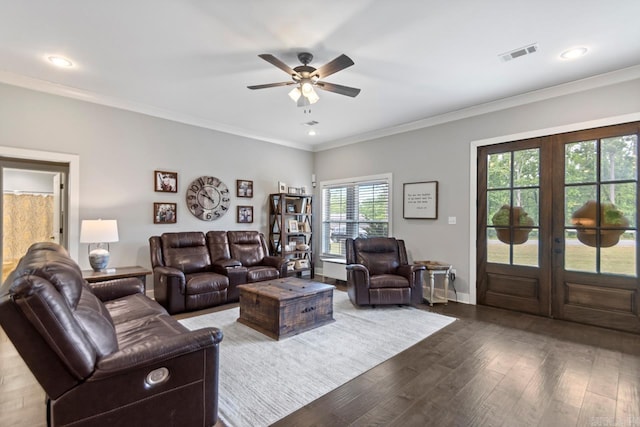 living room with ceiling fan, french doors, visible vents, wood finished floors, and ornamental molding