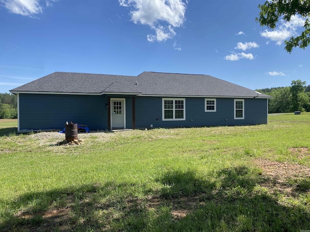 92 Revas Way, Story, AR 71970 - back of house featuring roof with shingles and a yard