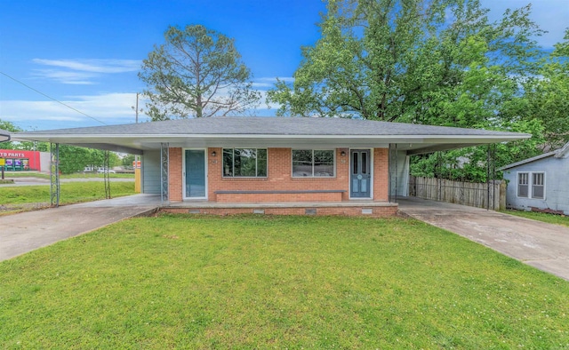 718 W 41st St, North Little Rock, AR 72118 - view of front of home with brick siding, driveway, a front yard, and a carport