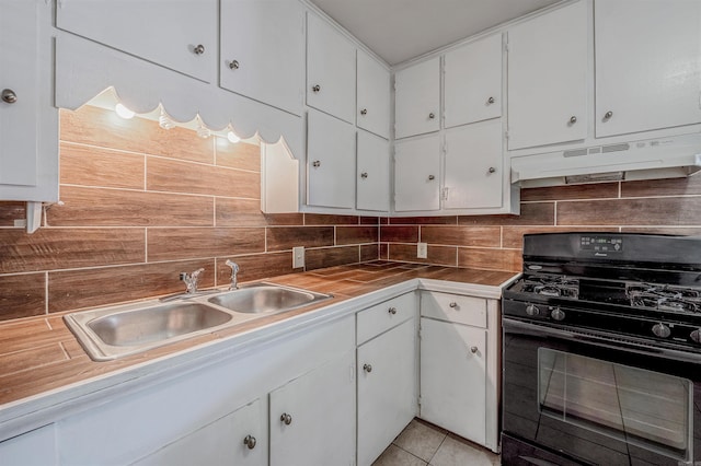718 W 41st St, North Little Rock, AR 72118 - kitchen with a sink, black gas stove, backsplash, and under cabinet range hood