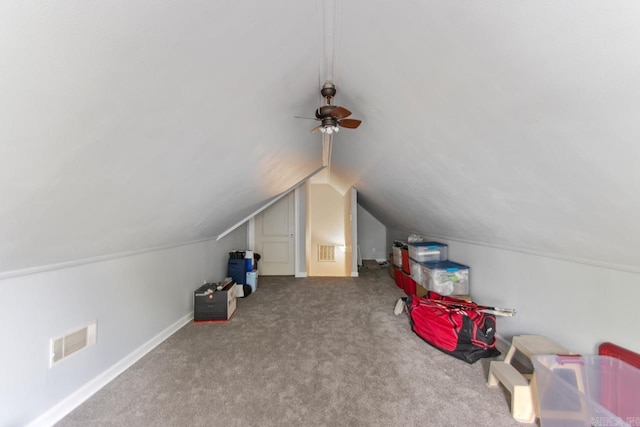 bonus room featuring a ceiling fan, visible vents, carpet floors, baseboards, and lofted ceiling