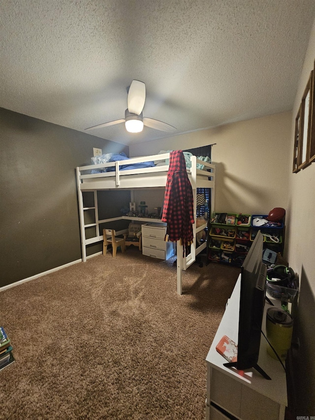 bedroom featuring a textured ceiling, ceiling fan, and carpet floors