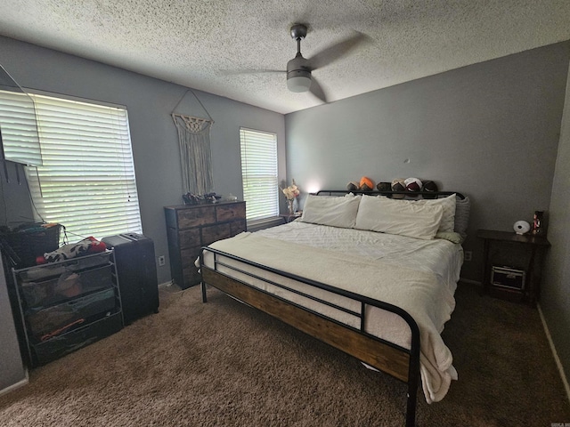 bedroom featuring a textured ceiling, a ceiling fan, and carpet floors