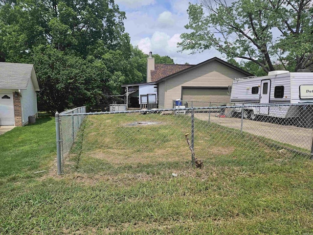 view of front of house featuring fence, a garage, a front lawn, and a chimney