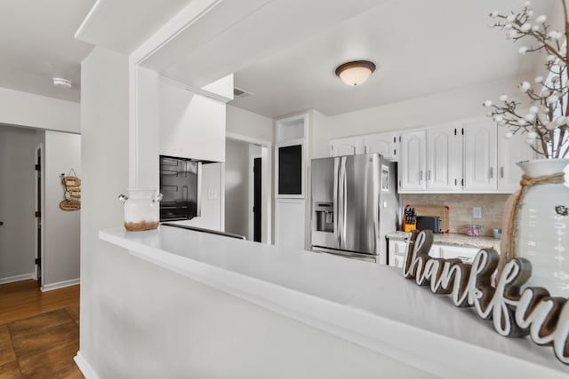 203 Stearns Pt Unit B6, Lake Hamilton, AR 71913 - kitchen featuring decorative backsplash, stainless steel refrigerator with ice dispenser, light countertops, white cabinets, and dark wood finished floors