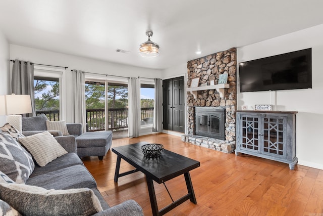 203 Stearns Pt Unit B6, Lake Hamilton, AR 71913 - living room with visible vents, wood finished floors, and a fireplace