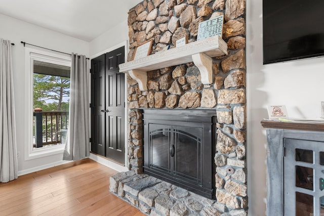 203 Stearns Pt Unit B6, Lake Hamilton, AR 71913 - interior space with baseboards, wood finished floors, and a fireplace