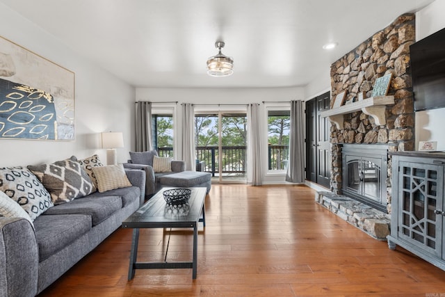203 Stearns Pt Unit B6, Lake Hamilton, AR 71913 - living room with a stone fireplace and hardwood / wood-style flooring