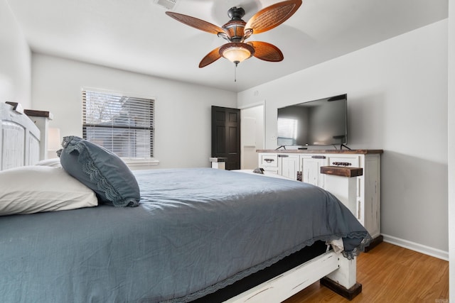 203 Stearns Pt Unit B6, Lake Hamilton, AR 71913 - bedroom with light wood-style floors, baseboards, ceiling fan, and multiple windows