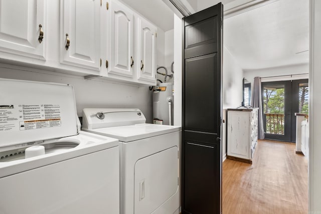 203 Stearns Pt Unit B6, Lake Hamilton, AR 71913 - laundry room with water heater, light wood-style floors, cabinet space, and washer and dryer