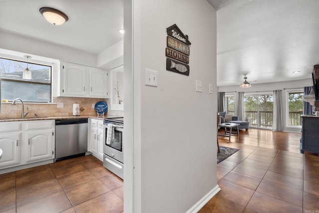 203 Stearns Pt Unit B6, Lake Hamilton, AR 71913 - kitchen with white cabinetry, light stone countertops, appliances with stainless steel finishes, and a sink