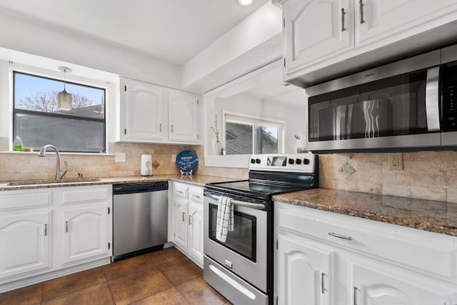 203 Stearns Pt Unit B6, Lake Hamilton, AR 71913 - kitchen with a sink, dark stone countertops, appliances with stainless steel finishes, and backsplash