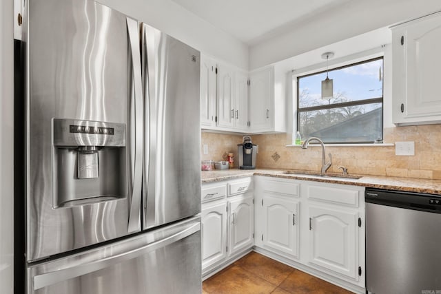 203 Stearns Pt Unit B6, Lake Hamilton, AR 71913 - kitchen with decorative backsplash, appliances with stainless steel finishes, light stone countertops, a sink, and white cabinetry