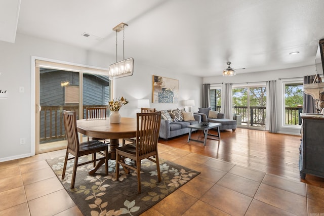 203 Stearns Pt Unit B6, Lake Hamilton, AR 71913 - dining room with baseboards, a notable chandelier, visible vents, and light tile patterned floors