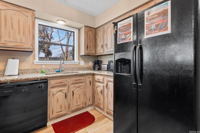 203 Stearns Pt Unit D1, Lake Hamilton, AR 71913 - kitchen featuring light brown cabinets, light stone counters, a sink, light wood finished floors, and black appliances