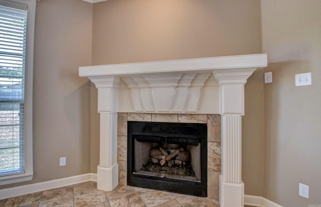 details with baseboards and a fireplace