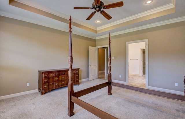 unfurnished bedroom with ornamental molding, baseboards, recessed lighting, a raised ceiling, and carpet flooring