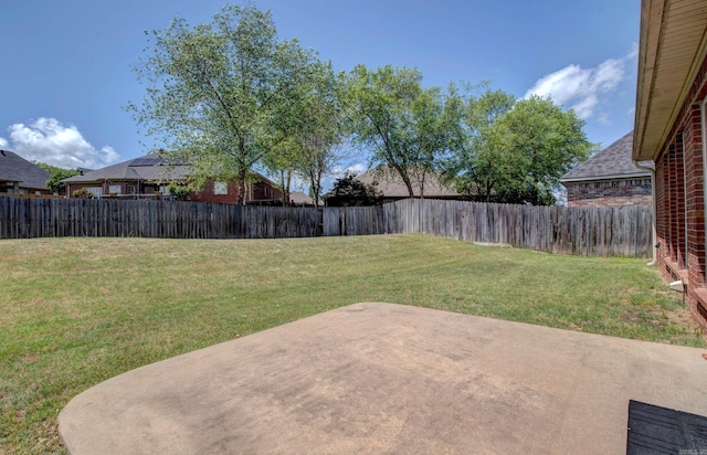view of yard with a fenced backyard and a patio area