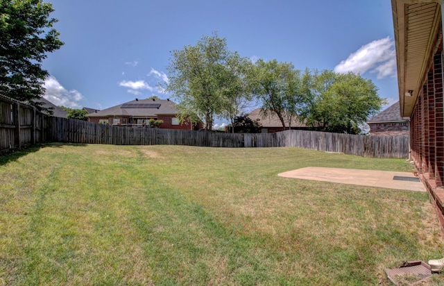view of yard featuring a fenced backyard and a patio area