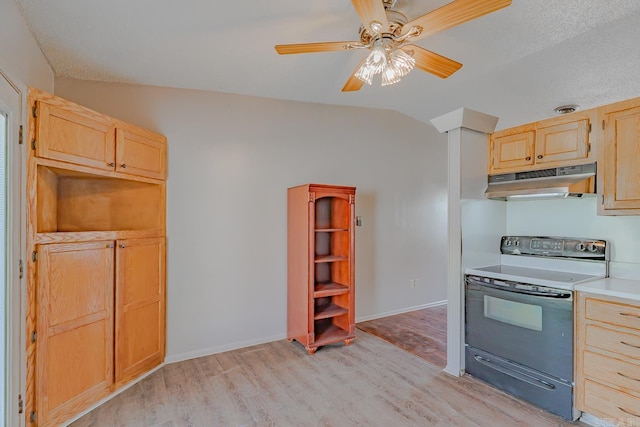 3210 Kingsbury St, Jonesboro, AR 72401 - kitchen with electric range, lofted ceiling, light brown cabinetry, under cabinet range hood, and light wood finished floors