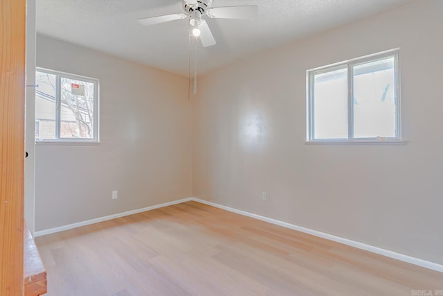 3210 Kingsbury St, Jonesboro, AR 72401 - spare room with light wood-style floors, baseboards, and a wealth of natural light
