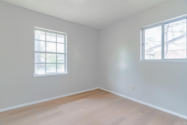 3210 Kingsbury St, Jonesboro, AR 72401 - unfurnished room with baseboards and light wood-type flooring