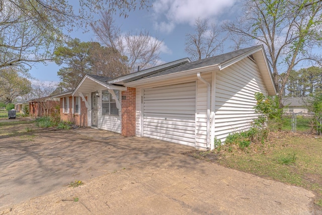 3210 Kingsbury St, Jonesboro, AR 72401 - view of home's exterior with concrete driveway, brick siding, and an attached garage