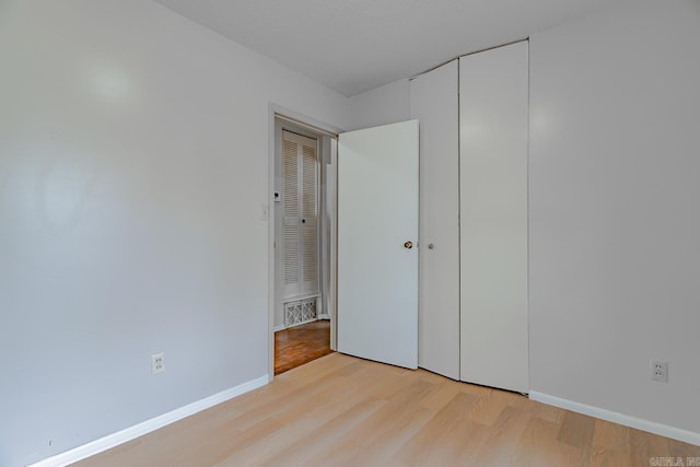 3210 Kingsbury St, Jonesboro, AR 72401 - unfurnished bedroom with baseboards and light wood finished floors