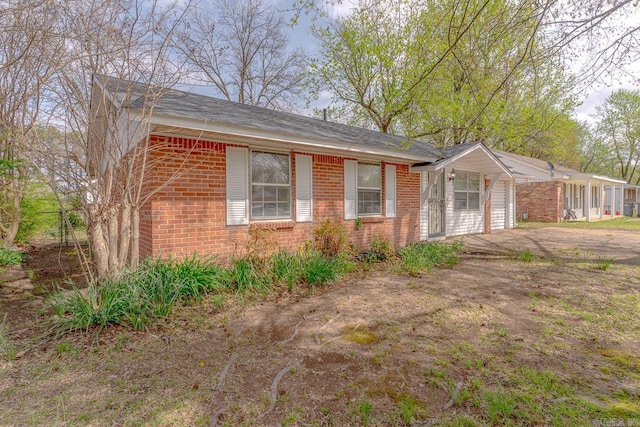 3210 Kingsbury St, Jonesboro, AR 72401 - view of front of property with a garage, aphalt driveway, and brick siding